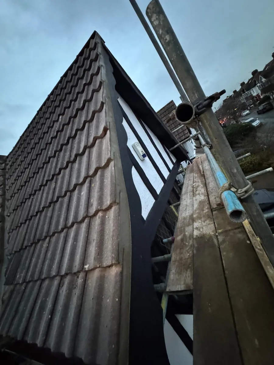 Close view of a tile-hung dormer cheek and scaffold pole