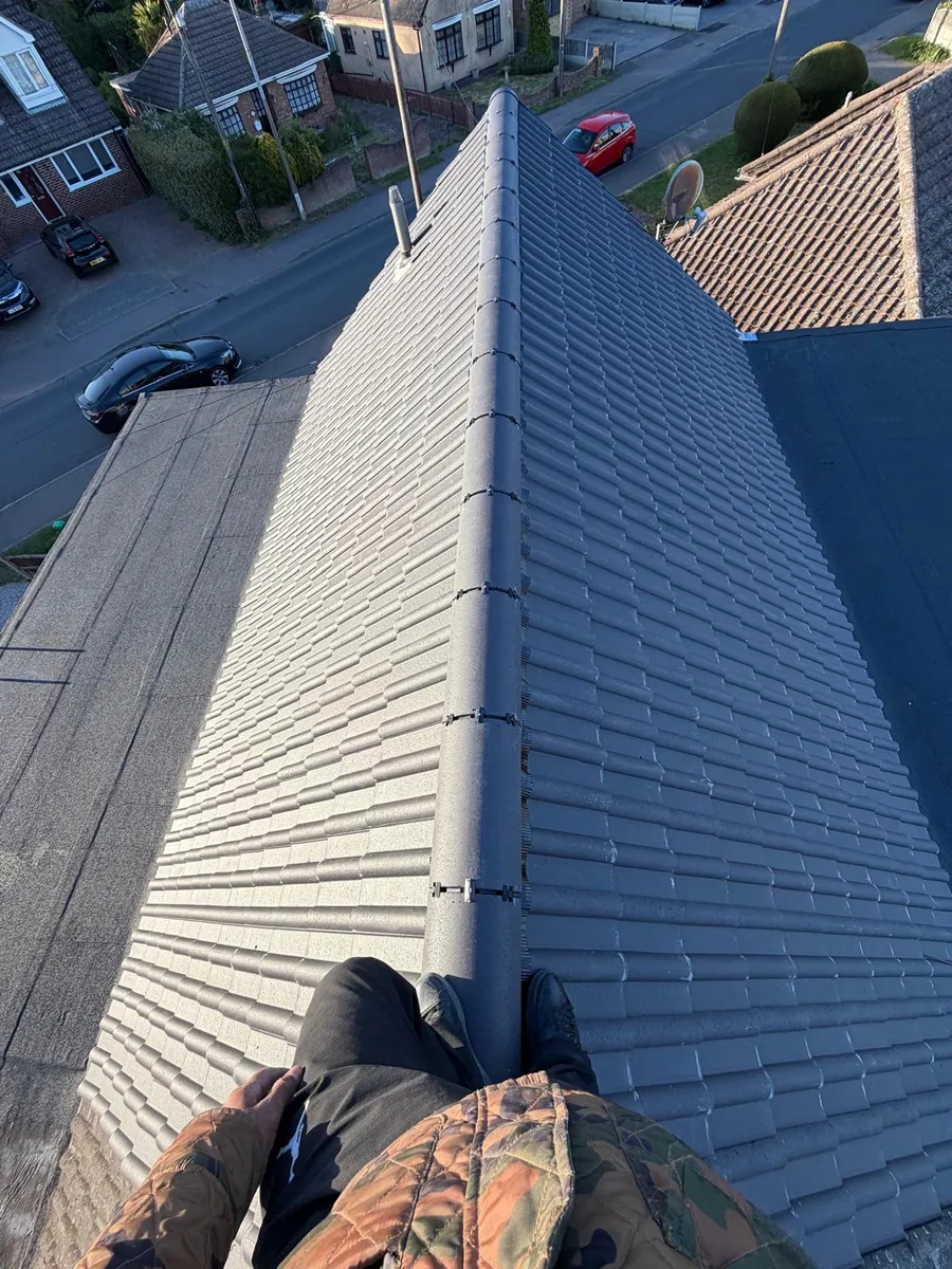 Long grey tiled roof with dry ridge fittings